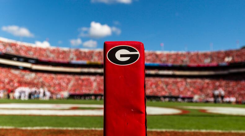 Field level view of a "Power G" branded end-zone pylon at Sanford Stadium.