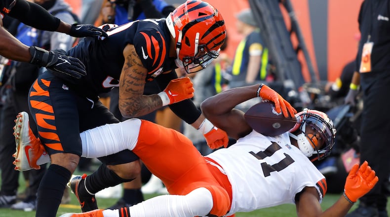 Donovan Peoples-Jones (11) of the Cleveland Browns is knocked out of bounds by Jessie Bates (30) of the Cincinnati Bengals during the fourth quarter at Paul Brown Stadium on Sunday, Nov. 7, 2021 in Cincinnati, Ohio. (Kirk Irwin/Getty Images/TNS)