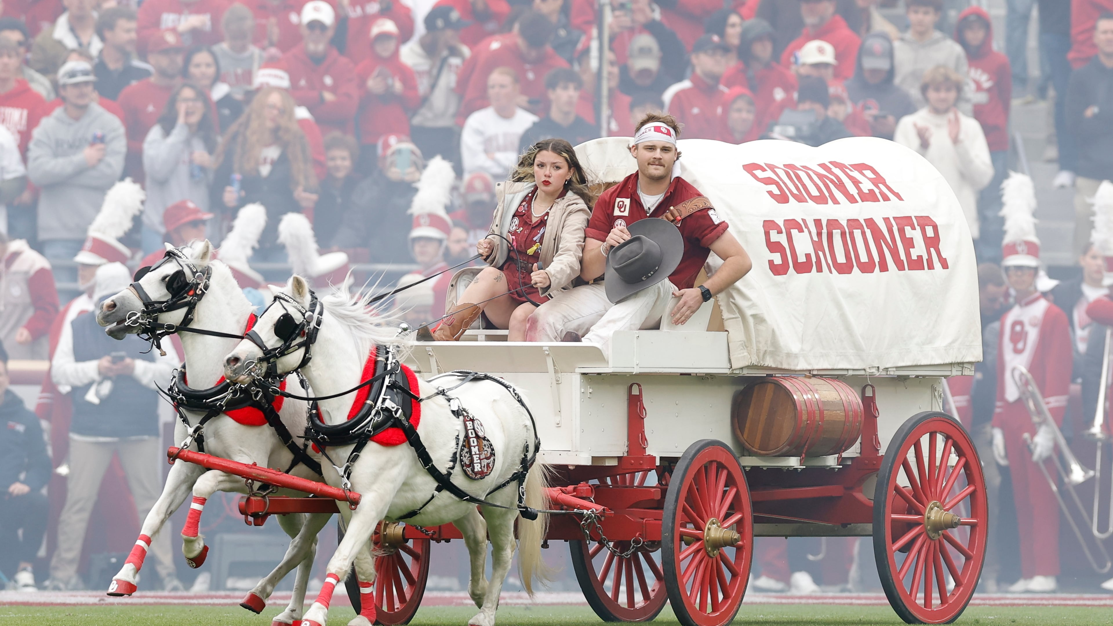 Members of the Oklahoma spirit groups drive the Sooner Schooner after a touchdown against Missouri during the first half of an NCAA college football game Saturday, Nov. 22, 2025, in Norman, Okla. (AP Photo/Alonzo Adams)