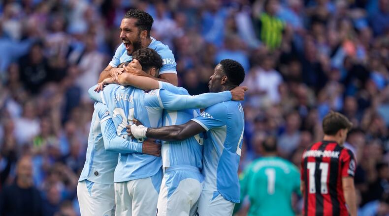 Manchester City's Josko Gvardiol (24) celebrates with teammates after scoring his side's second goal during the English Premier League soccer match between Manchester City and Bournemouth in Manchester, England, Sunday, Aug. 23, 2026. (AP Photo/Dave Thompson)