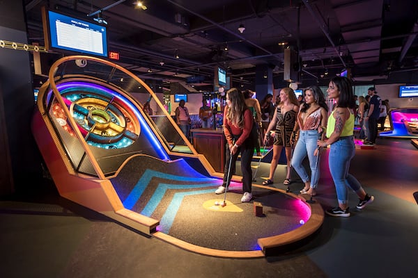 Puttshack offers mini golf with electronic scorekeeping, as well as food and drinks. Courtesy of Puttshack.