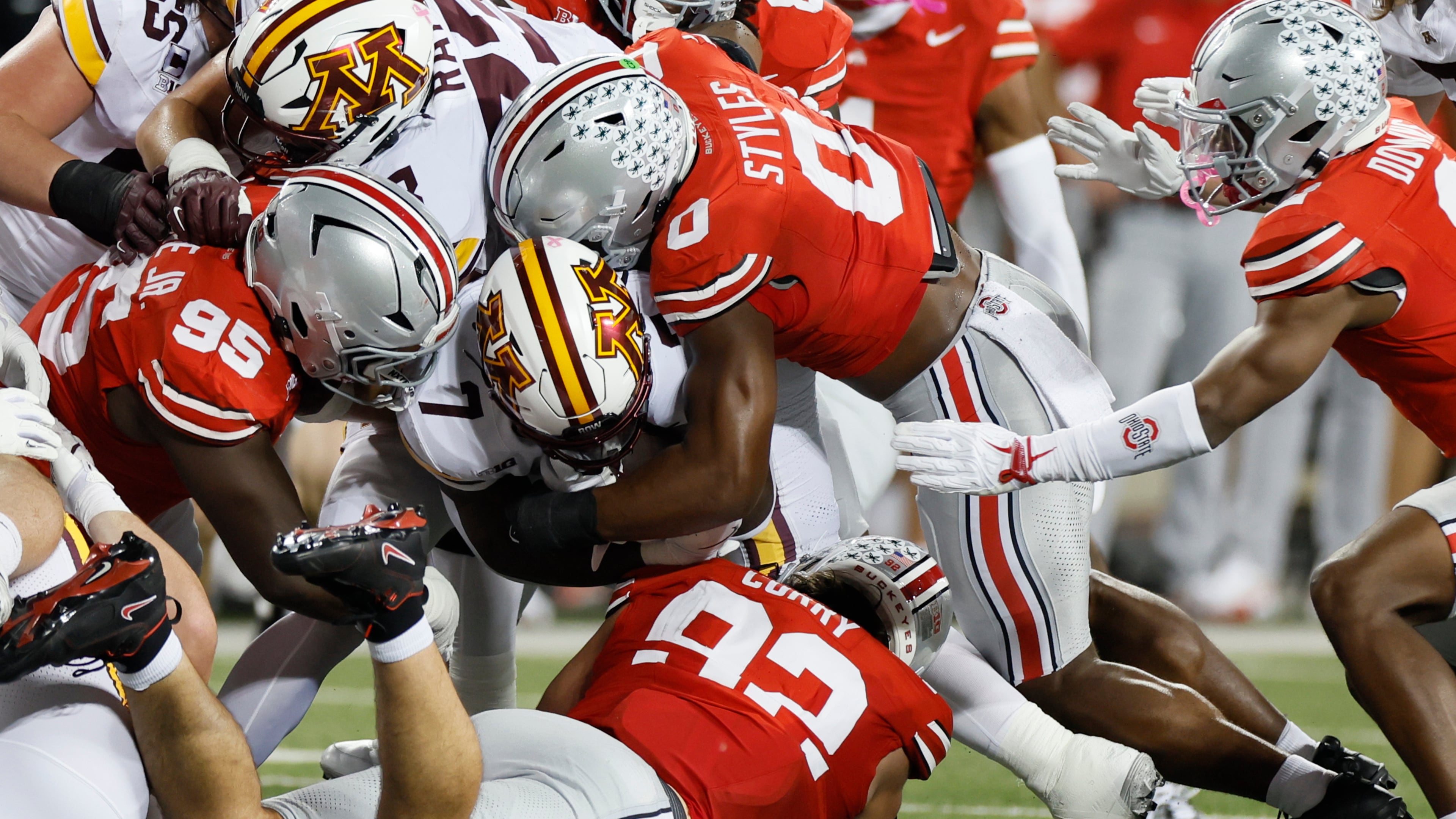 Ohio State defense swarms Minnesota running back Fame Ijeboi during the first half of an NCAA college football game, Saturday, Oct. 4, 2025, in Columbus, Ohio. (AP Photo/Jay LaPrete)