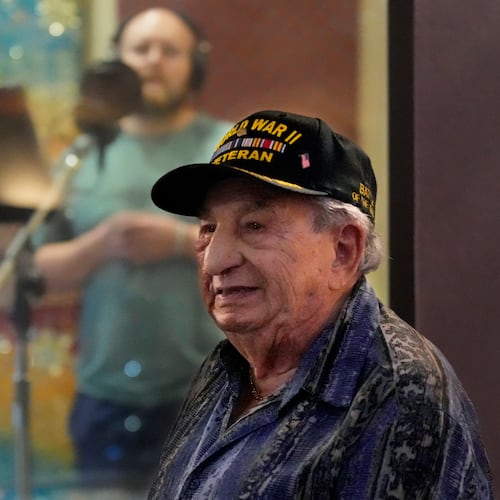 Irving Locker, a 101-year-old veteran of World War II, D-Day and the Battle of the Bulge, listens as Jesse Wayne Taylor, left, records a song based on Locker's military experience on Wednesday, Sept. 9, 2025, in Nashville, Tenn. (AP Photo/Mark Humphrey)