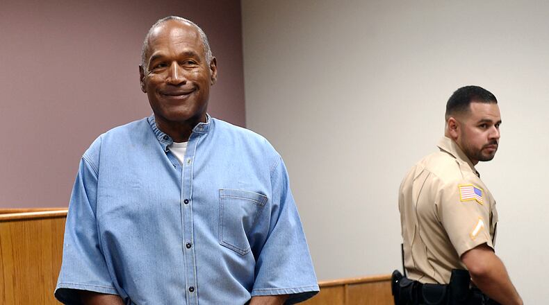 O.J. Simpson won the Heisman Trophy when he played college football at Southern Cal. (Jason Bean/The Reno Gazette-Journal via AP, Pool, File)