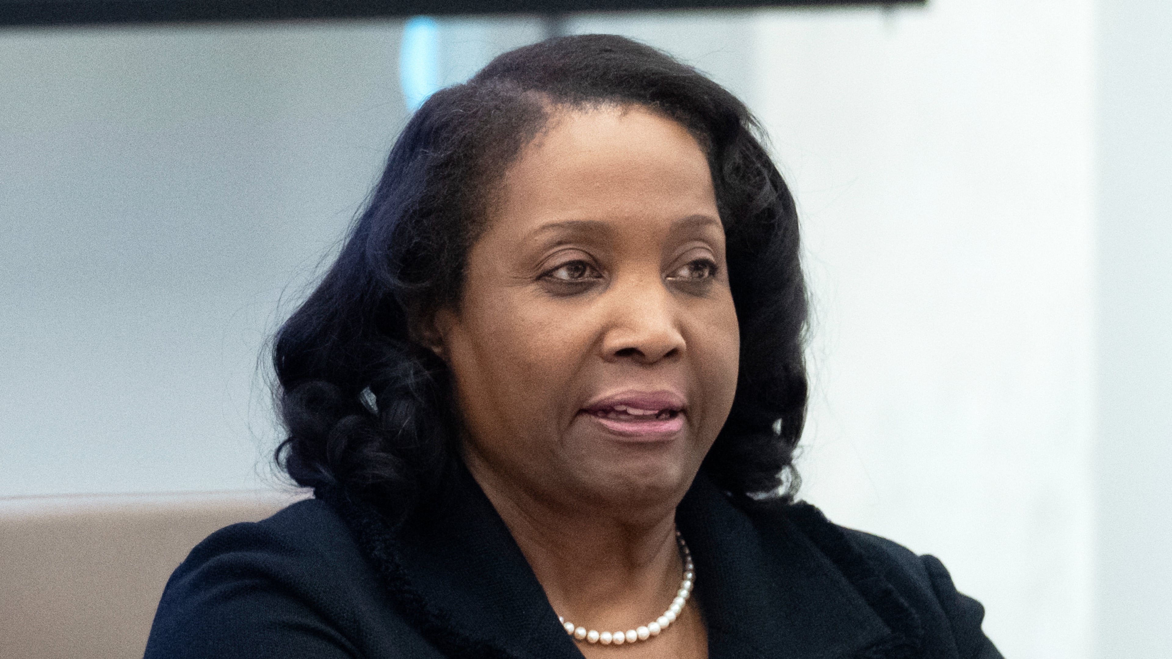FILE - Federal Reserve Board of Governors member Lisa Cook listens during an open meeting of the Board of Governors, June 25, 2025, in Washington. (AP Photo/Mark Schiefelbein, File)