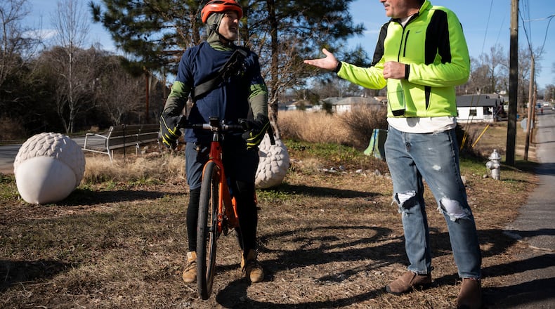 Angel Poventud (left) and Matt Garbett talk in an area close to Murphy Crossing on Tuesday, Jan. 14, 2025. (Olivia Bowdoin for the AJC)