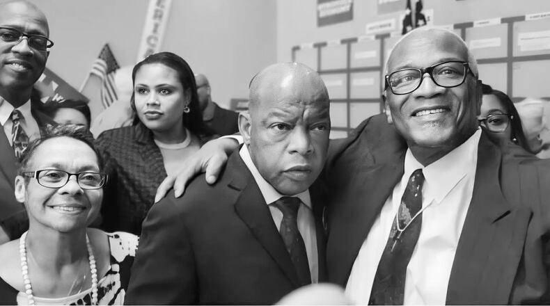 From left, Brenda Harris, U.S. Rep. John Lewis and Bishop Bill Harris. (Courtesy of Kenya Simmons)