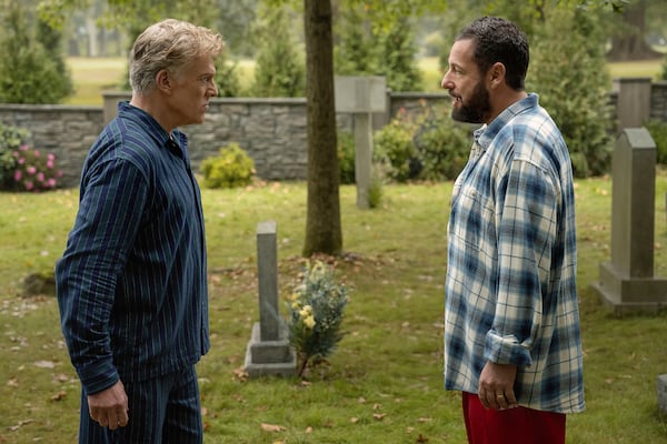 This image released by Netflix shows Christopher McDonald, left, and Adam Sandler in a scene from "Happy Gilmore 2." (Scott Yamano/Netflix via AP)