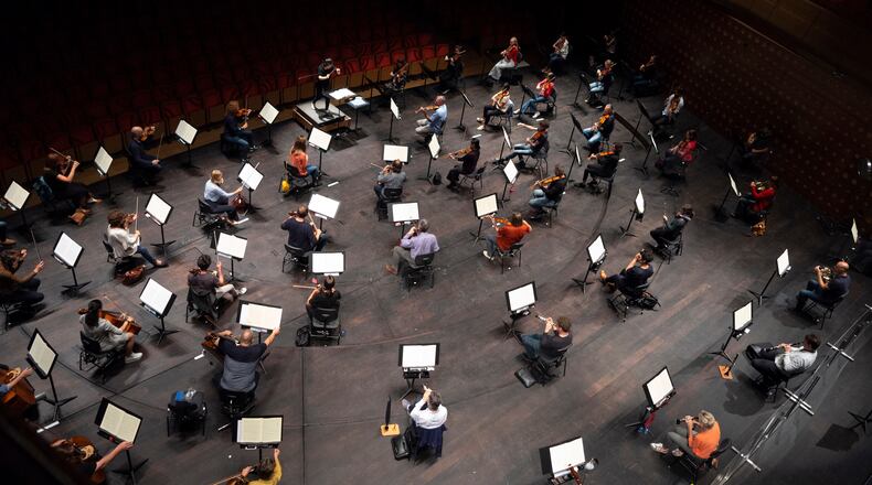 FILE - Chief Conductor Elim Chan, center top, conducts the Antwerp Symphony Orchestra through a rehearsal at the Queen Elisabeth Hall in Antwerp, Belgium, July 1, 2020. (AP Photo/Virginia Mayo, File)