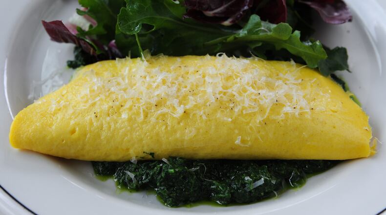 From @ajcdining: Is it possible to be in love with a breakfast dish? Because we're in deep with the omelette du jour at @bread_and_butterfly in Inman Park.