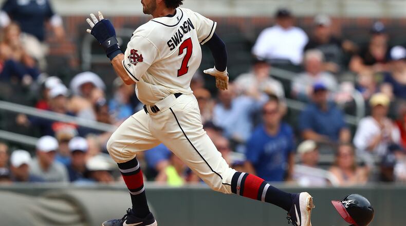 June 2, 2019 Atlanta: Atlanta Braves Dansby Swanson loses his helmet on his way from first base to home to score the go ahead run on Freddie Freemanâs RBI double taking a 4-3 lead over the Detroit Tigers during the eighth inning in a MLB baseball game on Sunday, June 2, 2019, in Atlanta. The Braves beat the Tigers 7-4. Curtis Compton/ccompton@ajc.com