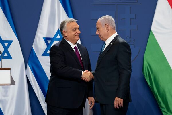 Hungarian Prime Minister Viktor Orban, left, and Israeli Prime Minister Benjamin Netanyahu, right, shake hands after a press statement at the Carmelite Monastery in the Buda Castle in Budapest, Hungary, Thursday, April 3, 2025. (AP Photo/Denes Erdos)