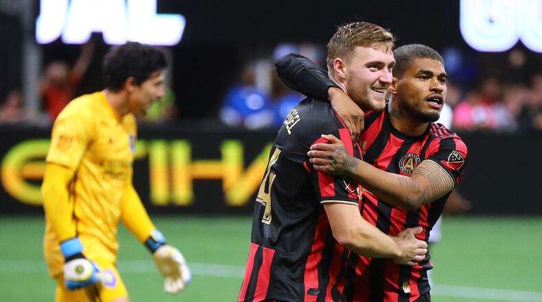 May 12, 2019 Atlanta: Atlanta United midfielder Julian Gressel (left) celebrates his apparent goal past Orlando City goalkeeper Brian Rowe (left) with Josef Martinez during the second half in a MLS soccer match on Sunday, May 12, 2019, in Atlanta. The goal was taken off the board after review, but Atlanta United held on to win the game 1-0. Curtis Compton/ccompton@ajc.com