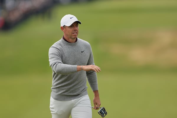 Rory McIlroy of Northern Ireland gestures as he walks on the 1st green during the first round of the British Open golf championship at the Royal Portrush Golf Club, Northern Ireland, Thursday, July 17, 2025. (AP Photo/Peter Morrison)