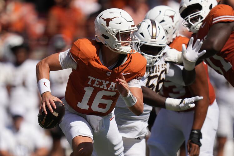 Texas quarterback Arch Manning (16) scrambles against Texas State during the first half of an NCAA college football game in Austin, Texas, Saturday, Sept. 5, 2026. (AP Photo/Eric Gay)
