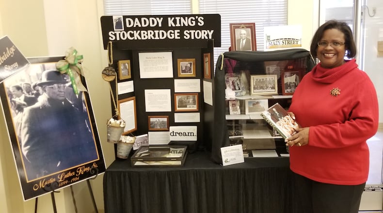 Stockbridge Main Street Manager Kira Harris-Braggs oversees a display on the Henry city's native son Martin Luther King Sr.