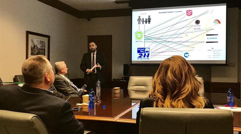 Matt Elder of HomeFirst Gwinnett briefs Gwinnett County officials on Feb. 5 on his organization’s plans, which include an assessment center and shelter near Norcross. TYLER ESTEP / TYLER.ESTEP@AJC.COM