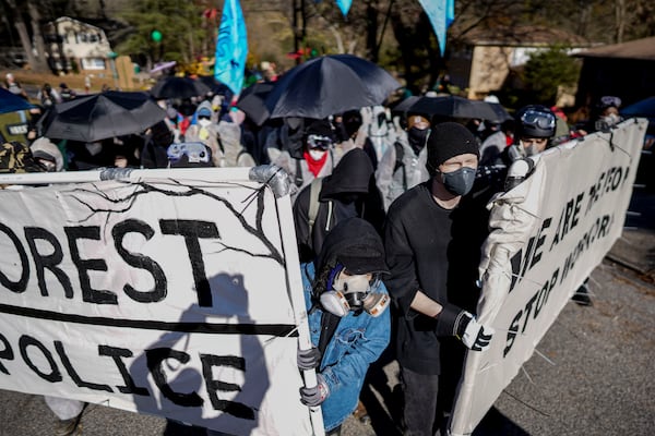 FILE - Protesters march during a demonstration in opposition to a new police training center on Nov. 13, 2023, in Atlanta. (AP Photo/Mike Stewart, File)