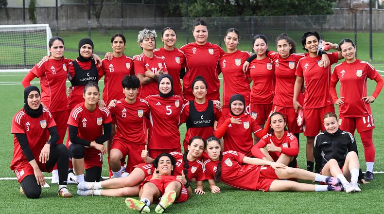 Afghan women's players pose for a team photo during a training session in Auckland, New Zealand, Tuesday, June 2, 2026. (Andrew Cornaga/Photosport via AP)