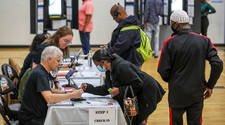 Counties will begin using GaRVIS, a new voter registration system, on Feb. 6. State Election Director Blake Evans says that when combined with a streamlined early voting check-in process, GaRVIS will eliminate the need for voters to fill out paper forms, average check-in times are expected to drop from about three minutes to 50 seconds. (John Spink / John.Spink@ajc.com)