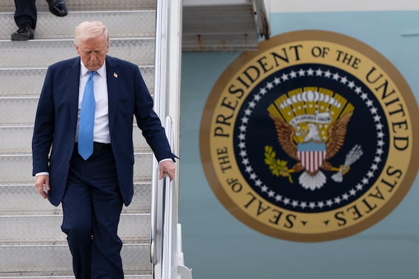 President Donald Trump arrives on Air Force One at Palm Beach International Airport, Friday, March 28, 2025, in West Palm Beach, Fla. (AP Photo/Manuel Balce Ceneta)