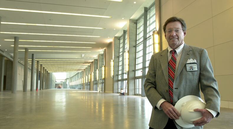 Dan Graveline at the entrance of a then-new wing of the Georgia World Congress Center, Atlanta's massive convention complex, in 2002. Graveline played a key role in much of the convention and tourist infrastructure in Atlanta. He also served on the Atlanta Committee for the Olympic Games and helped develop and build Centennial Olympic Park. (W.A. Bridges Jr./AJC 2002)