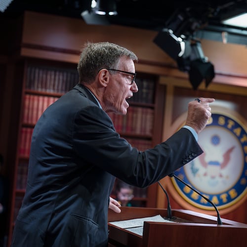 Sen. Mark Warner, D-Va., the top Democrat on the Senate Intelligence Committee, speaks about the Trump administration following reports that only Republican lawmakers received security briefings on the Trump-ordered military strikes against boats in the Caribbean, during a news conference at the Capitol in Washington, Thursday, Oct. 30, 2025. (AP Photo/J. Scott Applewhite)