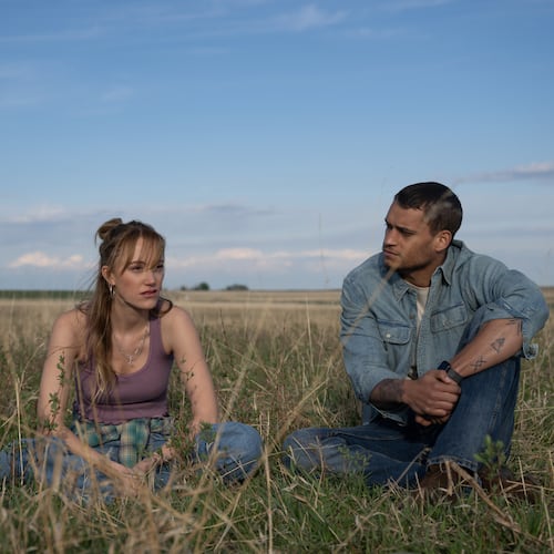 This image released by Universal Pictures shows Maika Monroe, left, and Tyriq Withers in a scene from "Reminders of Him." (Michelle Faye/Universal Pictures via AP)