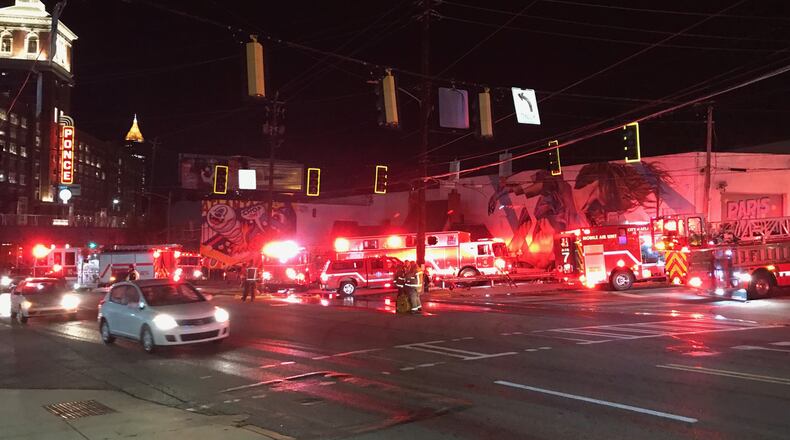 Crews are battling a large fire at Paris on Ponce, a 100-year-old building across the street from Ponce City Market, authorities said.