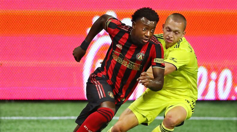 082220 Atlanta: Atlanta United defender George Bello works against Nashville SC defender Alistair Johnston in a  MLS soccer match on Saturday, August 22, 2020 in Atlanta.    Curtis Compton ccompton@ajc.com