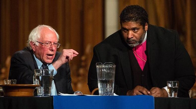 U.S. Sen. Bernie Sanders, left, and the Rev. William Barber II speak in a public forum on April, 19, 2018 at Duke Chapel in Durham. (via Travis Long/The News & Observer)