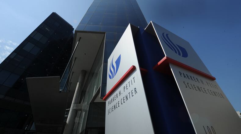 The shooting occurred inside Georgia State University's Parker H. Petit Science Center, school police said. The officer was alert when he was taken to Grady Memorial Hospital.