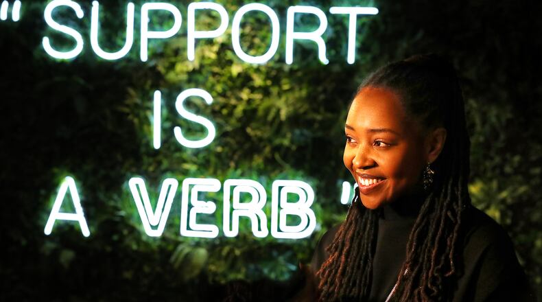Owner Lakeysha Hallmon discusses the concept of her store The Village at Ponce City Market with a large tag line to the community prominently displayed on one of the main walls on Monday, Nov 23, 2020, in Atlanta. “Curtis Compton / Curtis.Compton@ajc.com”