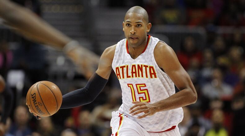 Atlanta Hawks center Al Horford dribbles during the first half of an NBA basketball game against the Chicago Bulls, Friday, Feb. 26, 2016, in Atlanta. (AP Photo/Brett Davis)