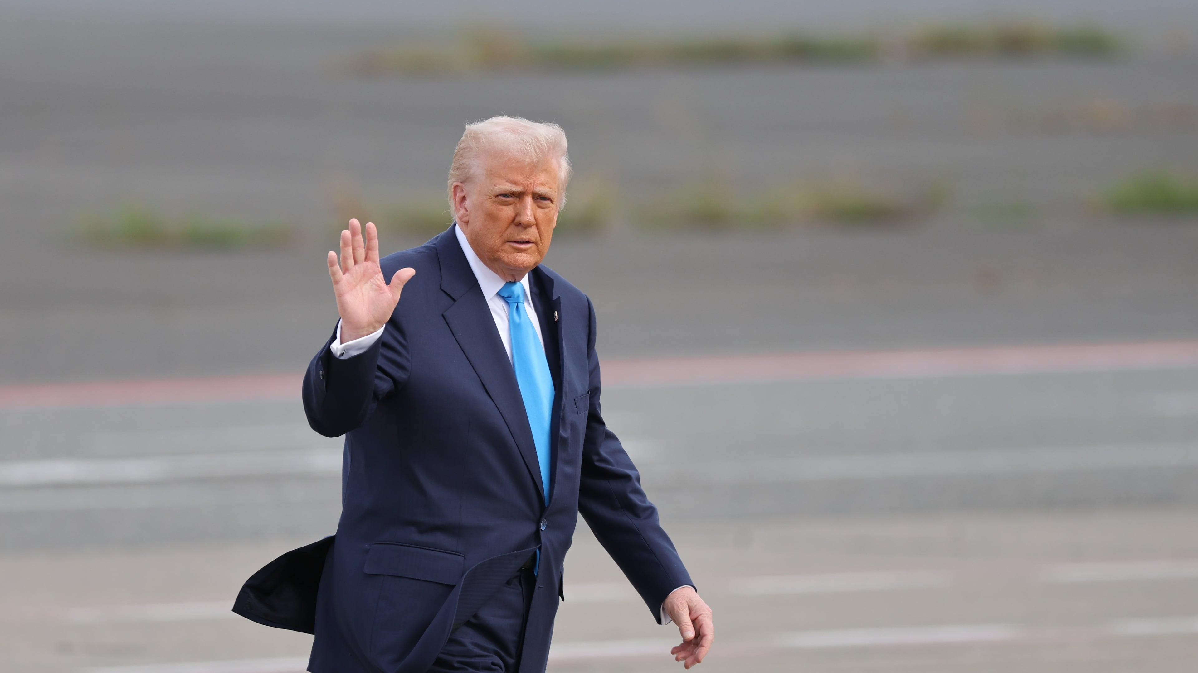 U.S. President Donald Trump walks towards Air Force One at Haneda Airport in Tokyo for his departure to South Korea, Wednesday, Oct. 29, 2025. (Kim Kyung-Hoon/Pool Photo via AP)