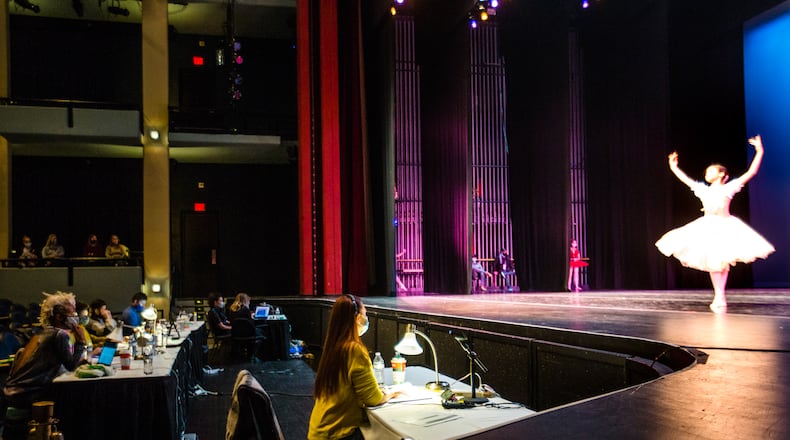 The Youth American Grand Prix ballet competition takes place with strict Covid19 precautions on Saturday, Jan 16, 2021, at the Infinite Energy Theater in Duluth. The organization requires masks, limits the number of audience members, conducts temperature checks and dancers can choose to compete with or without a mask but must exit and enter stage from the same location and immediately put back masks back on. (Jenni Girtman for The Atlanta Journal-Constitution)