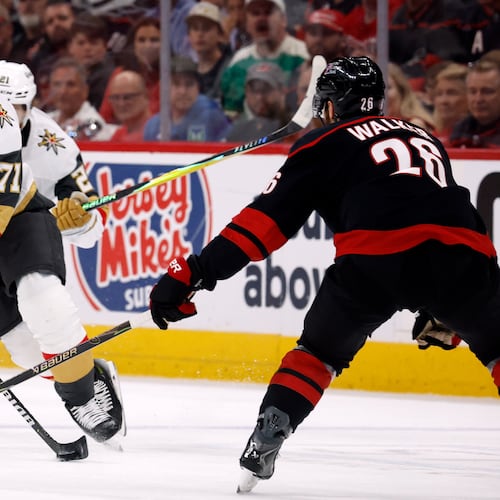 William Karlsson (71) moves the puck around Carolina Hurricanes' Sean Walker (26) during the first period in Game 5 of the NHL hockey Stanley Cup Final series in Raleigh, N.C., Thursday, June 11, 2026. (AP Photo/Karl DeBlaker)