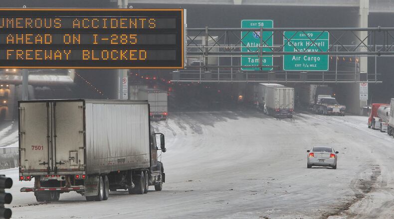 Metro area highways and roads were coated with snow and ice this month, leading to students missing multiple days of school. Photo: John Spink