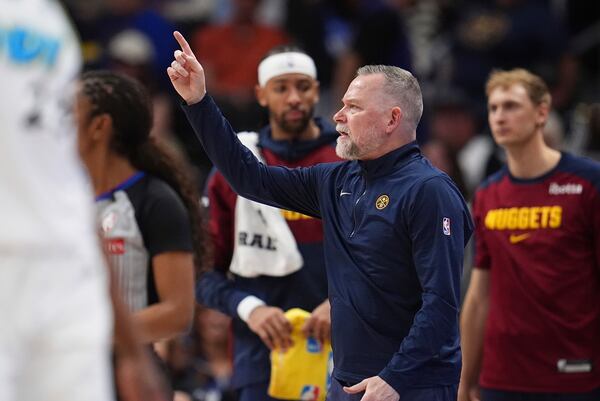 Denver Nuggets head coach Michael Malone directs his team against the Indiana Pacers in the second half of an NBA basketball game Sunday, April 6, 2025, in Denver. (AP Photo/David Zalubowski)
