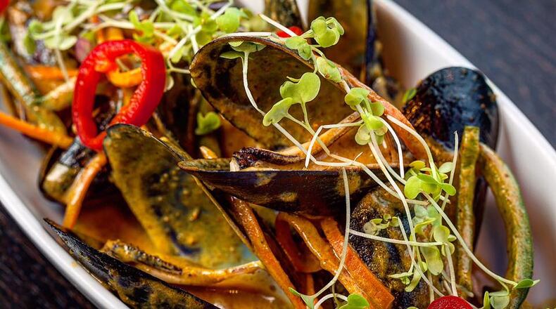 Mussels in red curry sauce are on the menu at Simon's in Midtown. / Photo from the Simon's Facebook page