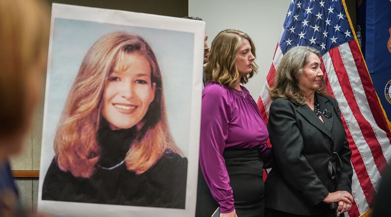 The mother, sister, and brother of slain UGA law student Tara Louise Baker are seen behind a photo of Baker during a press conference announcing an arrest in the 23-year-old cold case death on Monday, May 13, 2024, in Decatur. (Elijah Nouvelage for The Atlanta Journal-Constitution)