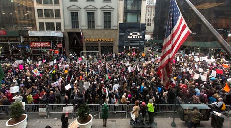 Demonstrators march on 5th Ave towards Trump Tower during a protest in New York, Saturday, Jan. 21, 2017. The march is being held in solidarity with similar events taking place in Washington and around the nation. (AP Photo/Alexander F. Yuan)