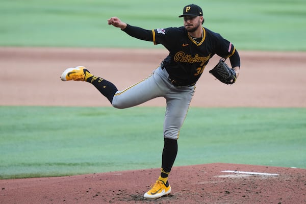 Pittsburgh Pirates pitcher Paul Skenes follows through on a delivery during the fourth inning of an opening-day baseball game against the Miami Marlins, Thursday, March 27, 2025, in Miami. (AP Photo/Lynne Sladky)