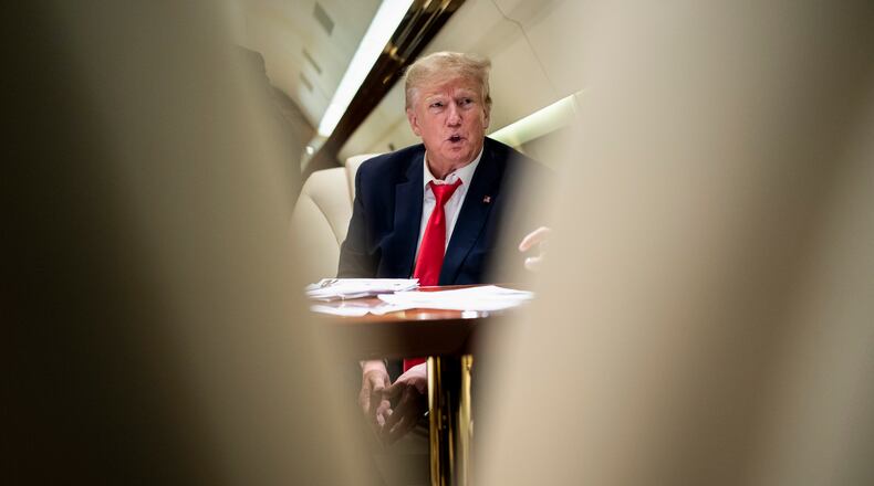 FILE — Former President Donald Trump on his plane flying to Columbia, S.C., for a stop in his 2024 campaign, on Jan. 28, 2023. The indictment unveiled on Tuesday, Aug. 1, 2023, accused Trump of enlisting six co-conspirators in “his criminal efforts to overturn the legitimate results of the 2020 presidential election and retain power.” (Doug Mills/The New York Times)