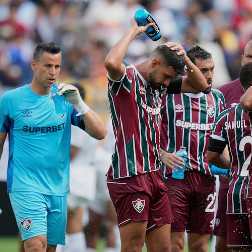 FILE - Fluminense players cooling up during a water break at the Club World Cup quarterfinal soccer match between Fluminense and Al Hilal in Orlando, Fla., Friday, July 4, 2025. (AP Photo/John Raoux, file)