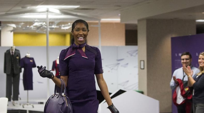 Kyandra Ravenel, a Delta airlines flight attendant, walks the runway during the uniform fitting for Delta employees at Hartsfield-Jackson Atlanta International Airport in Atlanta, Georgia, on Wednesday, February 7, 2018.