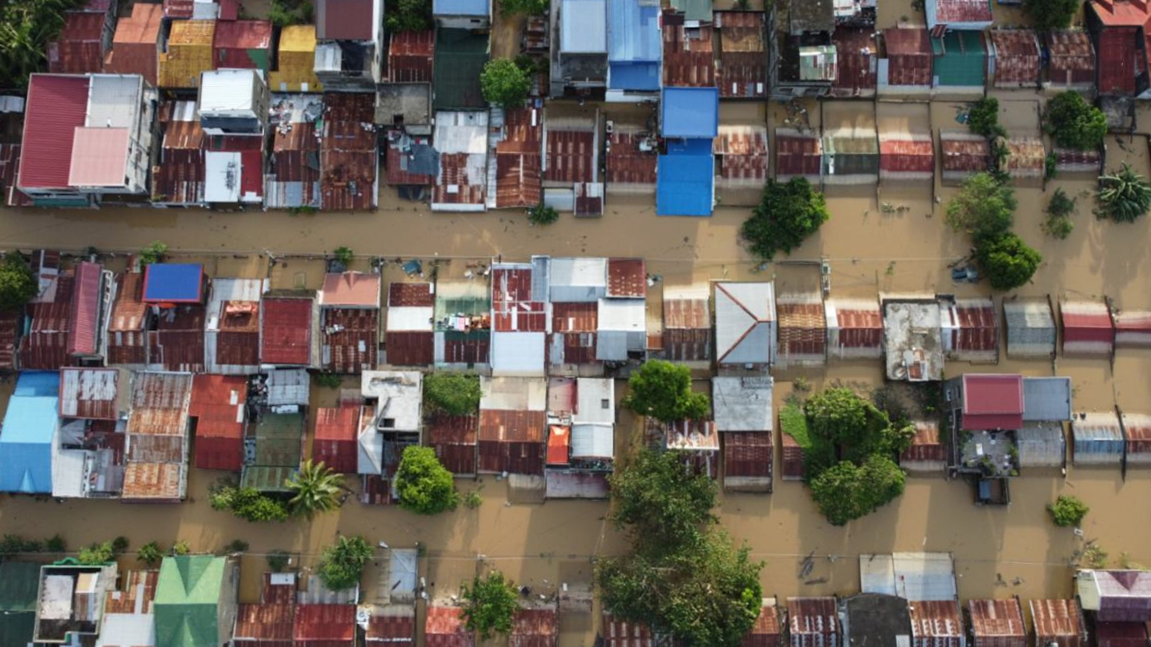 Houses are seen submerged in Ilagan, Isabela province, northern Philippines on Tuesday November 11. 2025 after the onslaught of Typhoon Fung-wong. (AP Photo/Villamor Visaya)