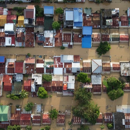 Houses are seen submerged in Ilagan, Isabela province, northern Philippines on Tuesday November 11. 2025 after the onslaught of Typhoon Fung-wong. (AP Photo/Villamor Visaya)