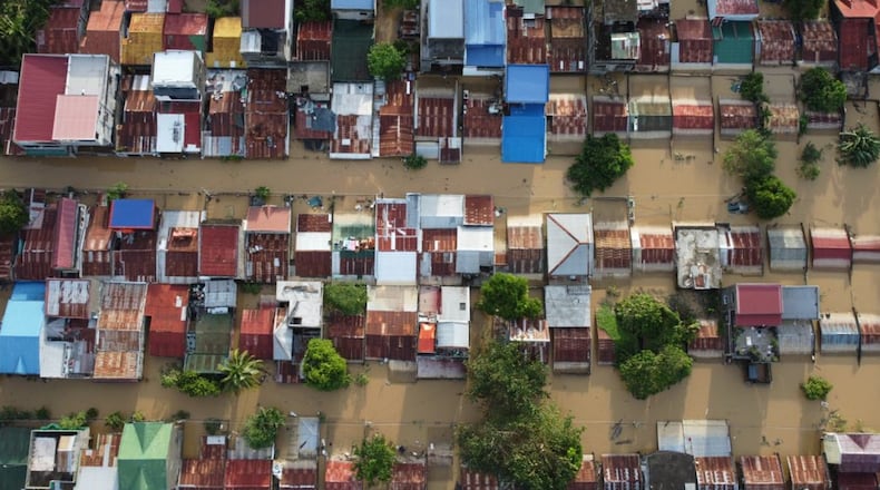 Houses are seen submerged in Ilagan, Isabela province, northern Philippines on Tuesday November 11. 2025 after the onslaught of Typhoon Fung-wong. (AP Photo/Villamor Visaya)