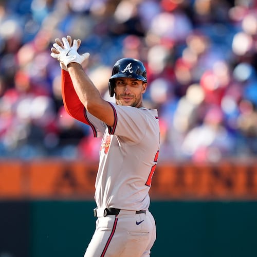 Atlanta Braves' Matt Olson reacts after hitting a three-run double against Philadelphia Phillies pitcher Connor Brogdon during the eighth inning of an opening-day baseball game, Friday, March 29, 2024, in Philadelphia. (AP Photo/Matt Slocum)